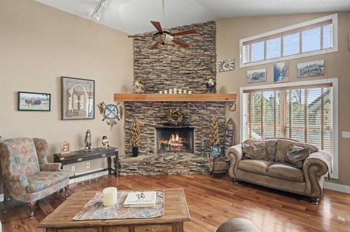 183 Discovery Ridge Way Sw, Calgary, AB - Indoor Photo Showing Living Room With Fireplace