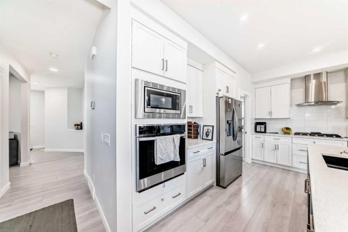 2004 Ravensdun Crescent Se, Airdrie, AB - Indoor Photo Showing Kitchen With Stainless Steel Kitchen With Upgraded Kitchen