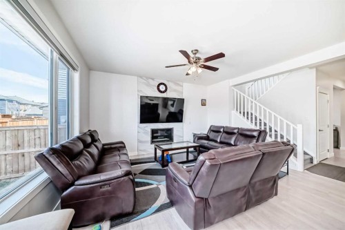 2004 Ravensdun Crescent Se, Airdrie, AB - Indoor Photo Showing Living Room With Fireplace