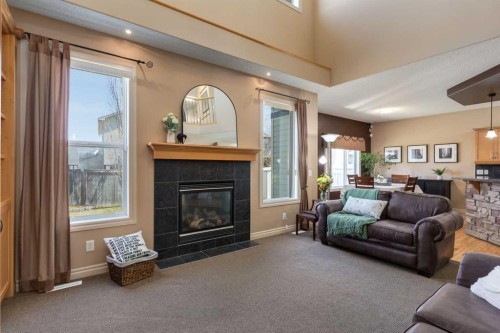 195 Willowmere Close, Chestermere, AB - Indoor Photo Showing Living Room With Fireplace