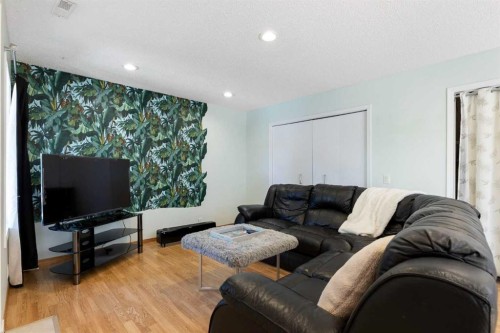 1030 Mckenzie Lake Bay Se, Calgary, AB - Indoor Photo Showing Living Room
