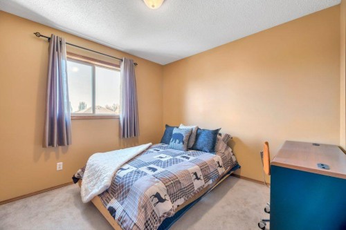 7 Springs Crescent Se, Airdrie, AB - Indoor Photo Showing Bedroom