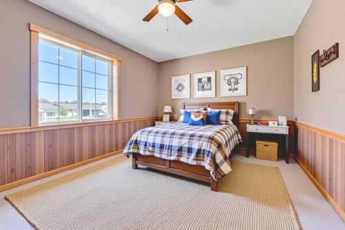 7 Springs Crescent Se, Airdrie, AB - Indoor Photo Showing Bedroom