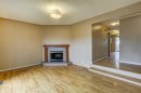 1163 Falworth Road Ne, Calgary, AB  - Indoor Photo Showing Living Room With Fireplace 