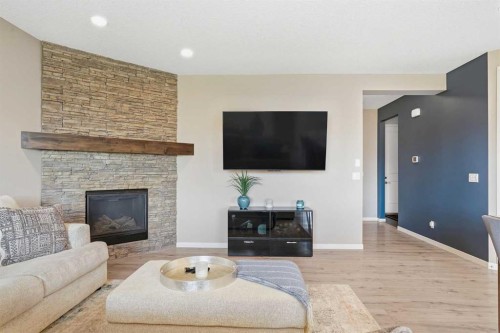 296 Walden Parade Se, Calgary, AB - Indoor Photo Showing Living Room With Fireplace