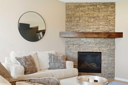 296 Walden Parade Se, Calgary, AB - Indoor Photo Showing Living Room With Fireplace