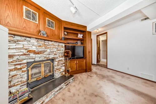 131 Ranchlands Court Nw, Calgary, AB - Indoor With Fireplace