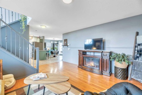 512 Highland Close, Strathmore, AB - Indoor Photo Showing Living Room With Fireplace