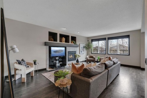 55 Evanspark Circle Nw, Calgary, AB - Indoor Photo Showing Living Room With Fireplace