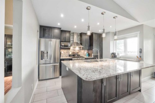228 Wood Valley Bay Sw, Calgary, AB - Indoor Photo Showing Kitchen With Upgraded Kitchen