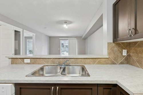 9216-70 Panamount Drive Nw, Calgary, AB - Indoor Photo Showing Kitchen With Double Sink