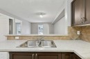 9216-70 Panamount Drive Nw, Calgary, AB  - Indoor Photo Showing Kitchen With Double Sink 