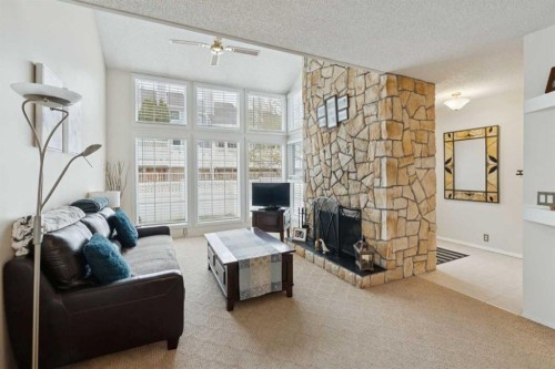 38-28 Berwick Crescent Nw, Calgary, AB - Indoor Photo Showing Living Room With Fireplace