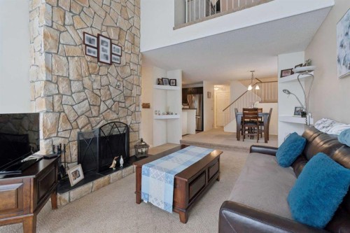 38-28 Berwick Crescent Nw, Calgary, AB - Indoor Photo Showing Living Room With Fireplace