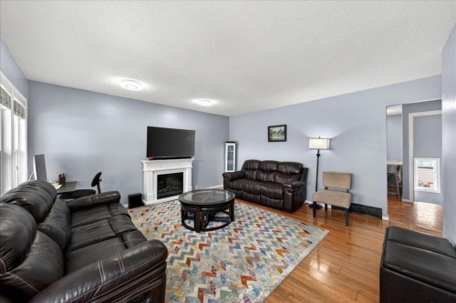 3620 28 Street Se, Calgary, AB - Indoor Photo Showing Living Room With Fireplace