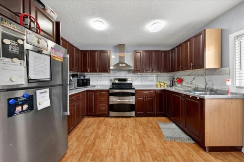 3620 28 Street Se, Calgary, AB - Indoor Photo Showing Kitchen With Double Sink