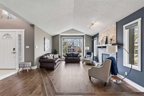 756 East Chestermere Drive, Chestermere, AB - Indoor Photo Showing Living Room With Fireplace