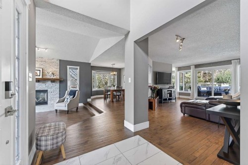 756 East Chestermere Drive, Chestermere, AB - Indoor Photo Showing Living Room With Fireplace