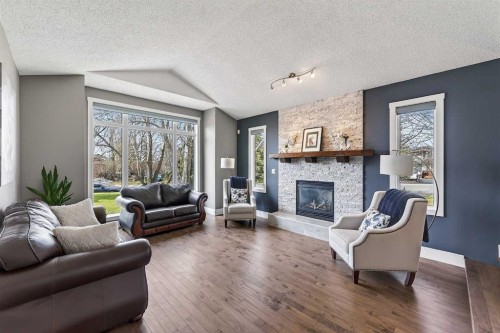 756 East Chestermere Drive, Chestermere, AB - Indoor Photo Showing Living Room With Fireplace
