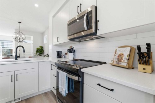 48 Magnolia Parade Se, Calgary, AB - Indoor Photo Showing Kitchen With Upgraded Kitchen