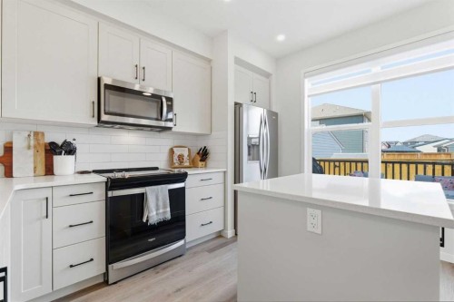 48 Magnolia Parade Se, Calgary, AB - Indoor Photo Showing Kitchen With Upgraded Kitchen