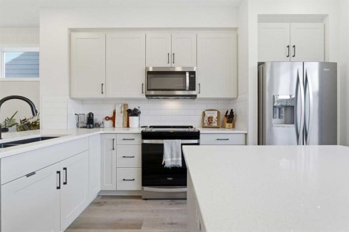 48 Magnolia Parade Se, Calgary, AB - Indoor Photo Showing Kitchen With Upgraded Kitchen