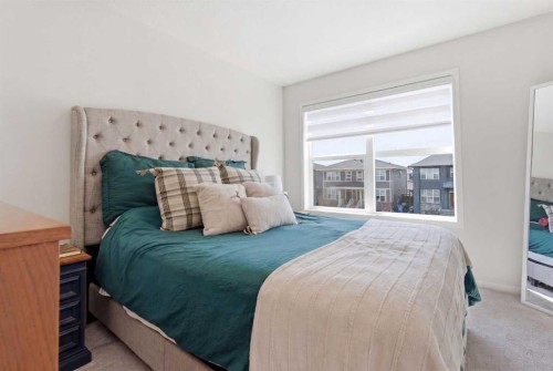 48 Magnolia Parade Se, Calgary, AB - Indoor Photo Showing Bedroom