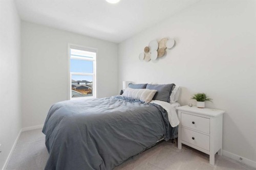 48 Magnolia Parade Se, Calgary, AB - Indoor Photo Showing Bedroom