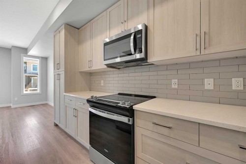 1132 Sage Hill Grove Nw, Calgary, AB - Indoor Photo Showing Kitchen With Upgraded Kitchen