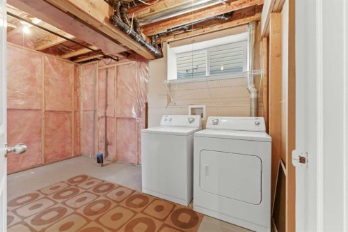 25 Everridge Way Sw, Calgary, AB - Indoor Photo Showing Laundry Room