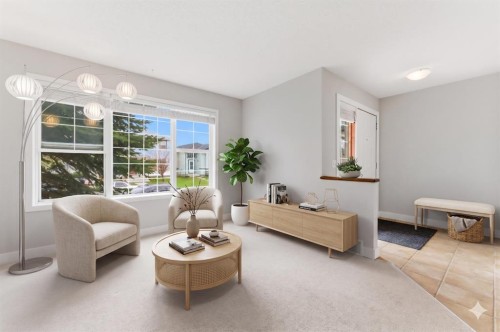 25 Everridge Way Sw, Calgary, AB - Indoor Photo Showing Living Room