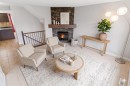 25 Everridge Way Sw, Calgary, AB  - Indoor Photo Showing Living Room With Fireplace 