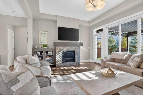 56 Cranbrook Landing Se, Calgary, AB - Indoor Photo Showing Living Room With Fireplace