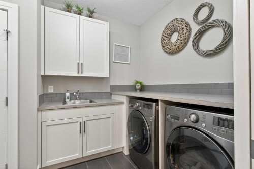 56 Cranbrook Landing Se, Calgary, AB - Indoor Photo Showing Laundry Room