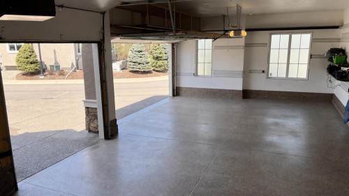 56 Cranbrook Landing Se, Calgary, AB - Indoor Photo Showing Garage
