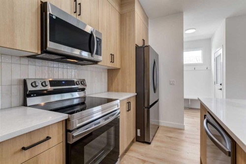 223 Sora Boulevard Se, Calgary, AB - Indoor Photo Showing Kitchen With Stainless Steel Kitchen