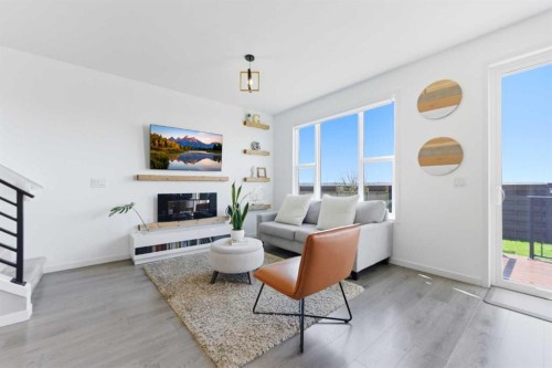 912 Seton Circle Se, Calgary, AB - Indoor Photo Showing Living Room With Fireplace
