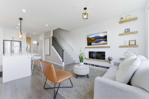 912 Seton Circle Se, Calgary, AB - Indoor Photo Showing Living Room With Fireplace