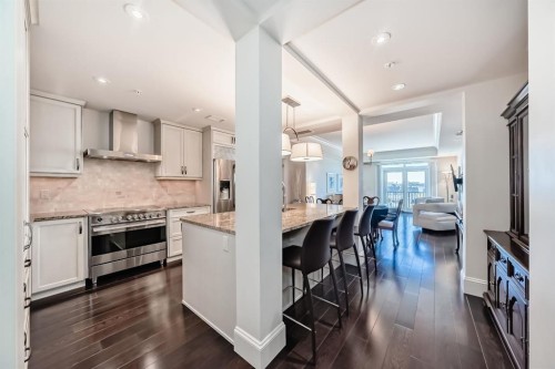 404-211 Quarry Way Se, Calgary, AB - Indoor Photo Showing Kitchen With Stainless Steel Kitchen With Upgraded Kitchen