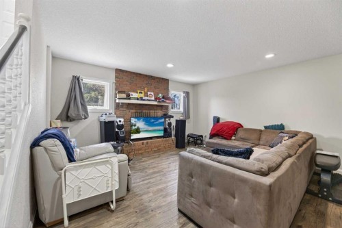 5218 Silverpark Close, Olds, AB - Indoor Photo Showing Living Room With Fireplace