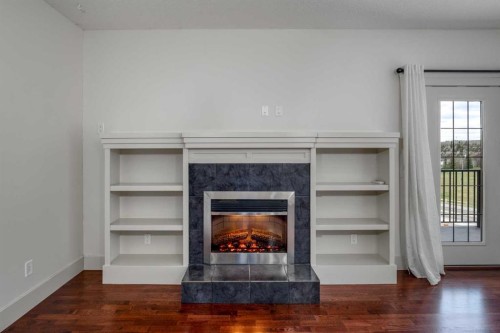 213-77 George Fox Trail West, Cochrane, AB - Indoor With Fireplace