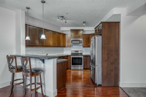213-77 George Fox Trail West, Cochrane, AB - Indoor Photo Showing Kitchen