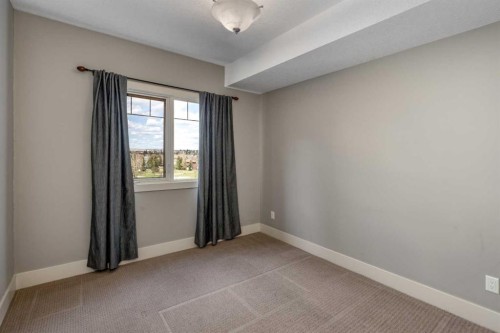 213-77 George Fox Trail West, Cochrane, AB - Indoor Photo Showing Other Room