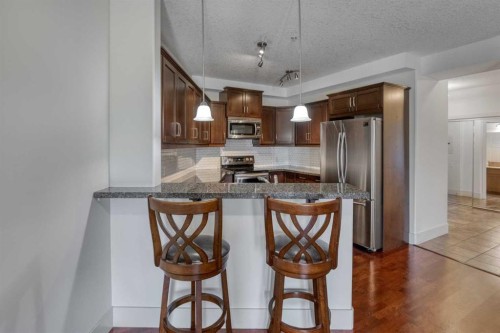 213-77 George Fox Trail West, Cochrane, AB - Indoor Photo Showing Kitchen