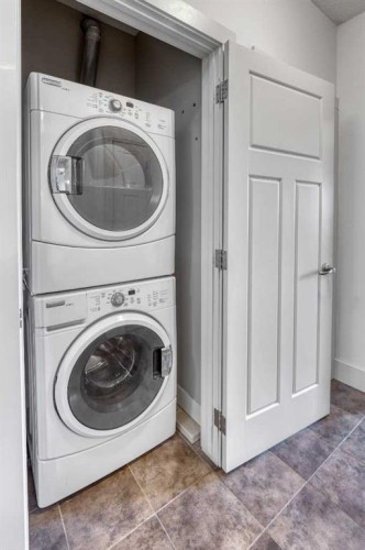 213-77 George Fox Trail West, Cochrane, AB - Indoor Photo Showing Laundry Room