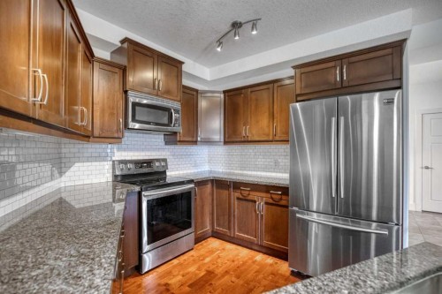 213-77 George Fox Trail West, Cochrane, AB - Indoor Photo Showing Kitchen