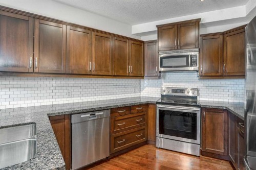213-77 George Fox Trail West, Cochrane, AB - Indoor Photo Showing Kitchen