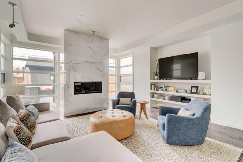 2304 4 Avenue Nw, Calgary, AB - Indoor Photo Showing Living Room With Fireplace
