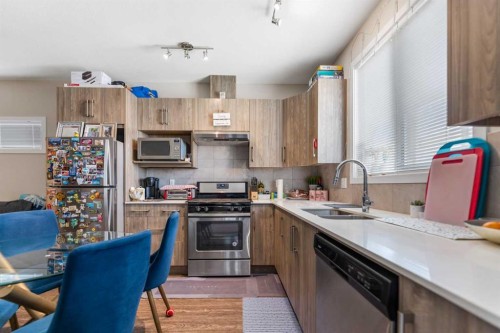 26 Redstone Way Ne, Calgary, AB - Indoor Photo Showing Kitchen With Stainless Steel Kitchen With Double Sink