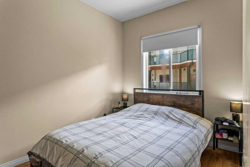 211-176 Kananaskis Way, Canmore, AB - Indoor Photo Showing Bedroom